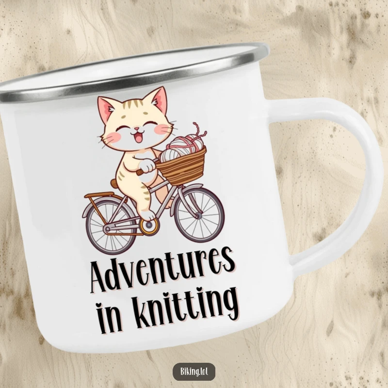 Funny giggling cat riding a bicycle with a basket full of yarn, designed for this sturdy and humorous camping mug.