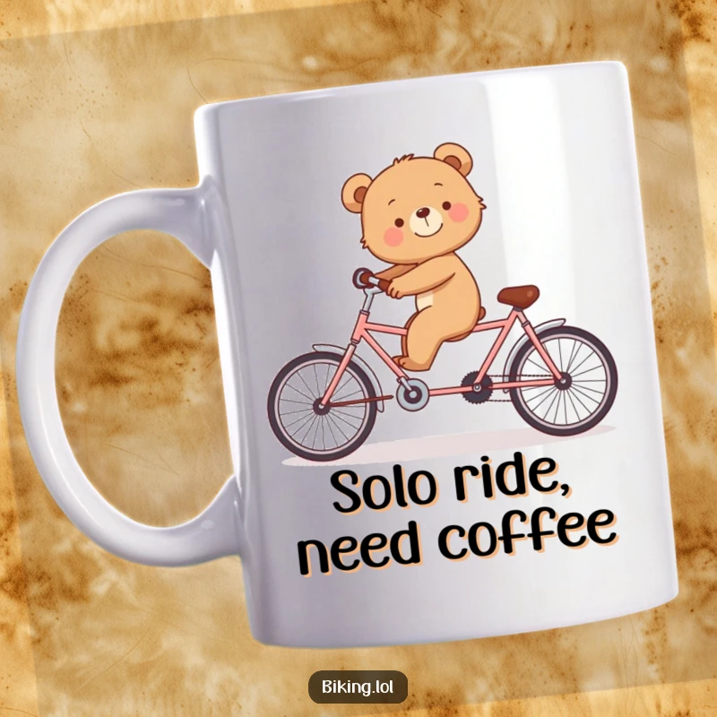 Funny mug with a smiling bear cub trying to balance on a tandem bicycle alone.