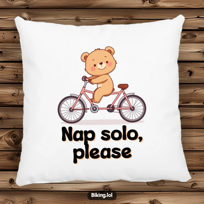 Funny pillow illustrating a smiling bear cub trying to keep balance on a tandem bicycle alone.