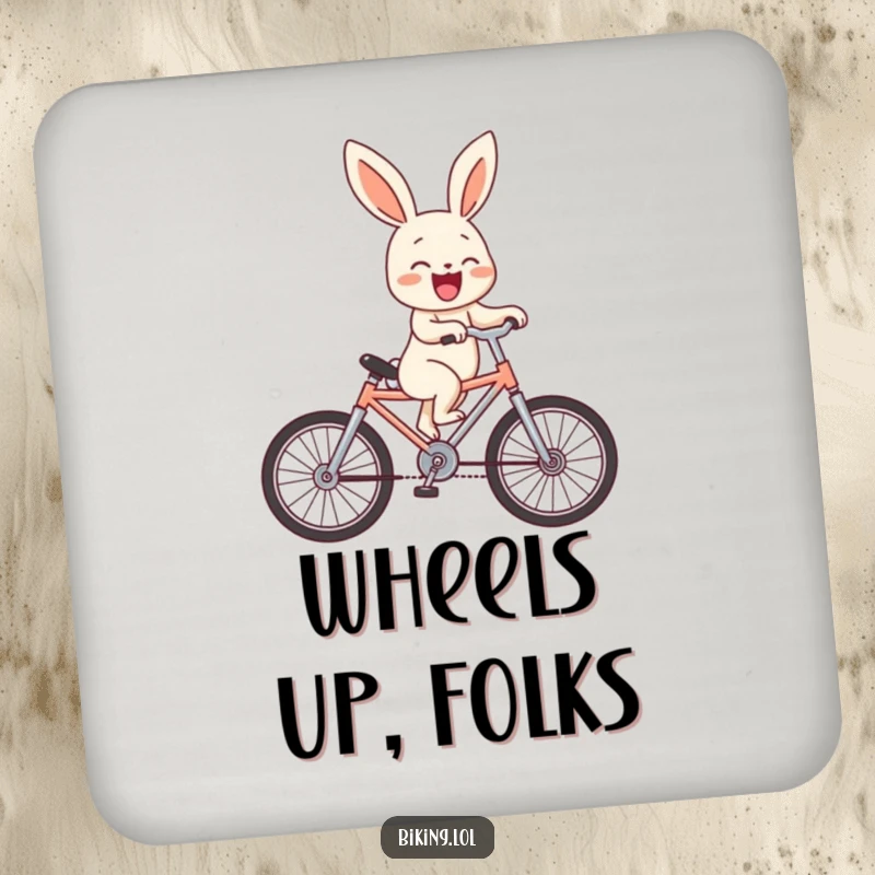 Funny bunny character doing a wheelie on a miniature bike, laughing, printed on a protective drink coaster.