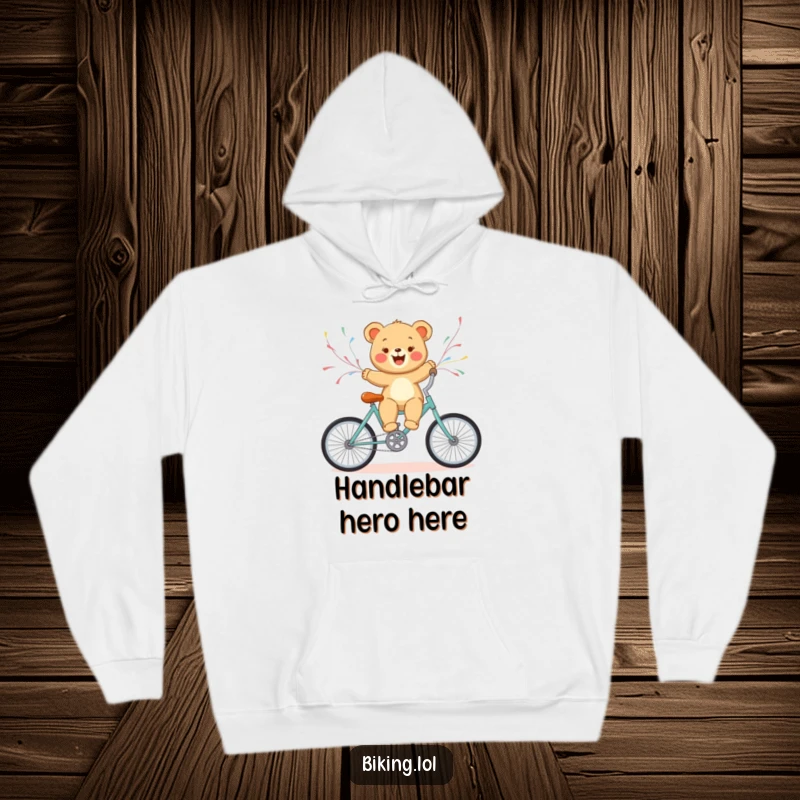 Funny bear cub enjoying a bicycle ride with streamers, captured on a cozy hoodie for ultimate comfort and cheer.