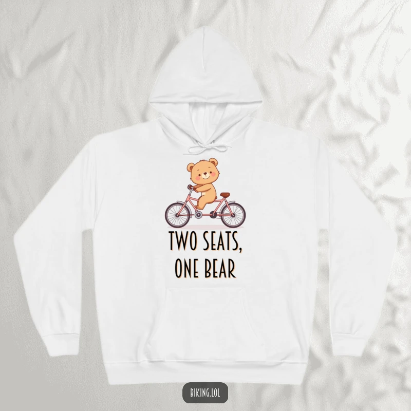 Funny hoodie with a smiling bear cub trying to balance on a tandem bicycle by itself.