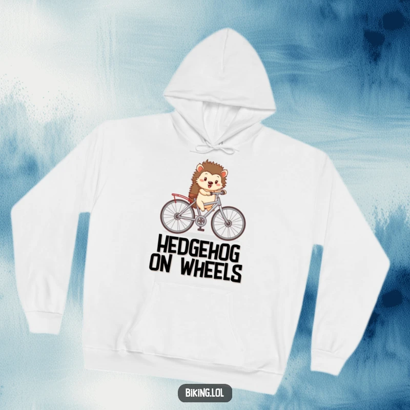 Funny hoodie design with a happy hedgehog pedaling a tiny bicycle with comically large wheels, offering cozy and imaginative warmth.