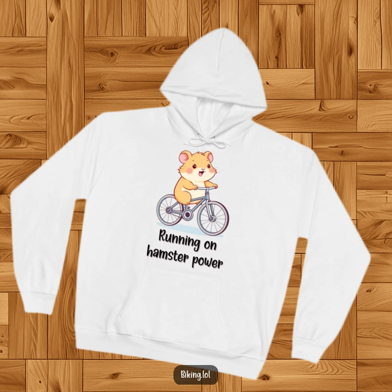 Funny Hamster Power Hoodie, a smiling hamster, pedaling a bicycle, cozy and humorous, perfect for chilly days.