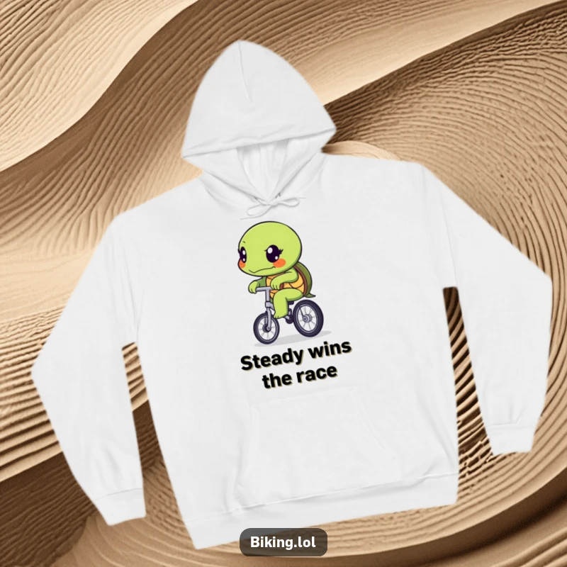 Funny determined turtle character slowly pedaling a unicycle, captured on a warm and cozy hoodie.