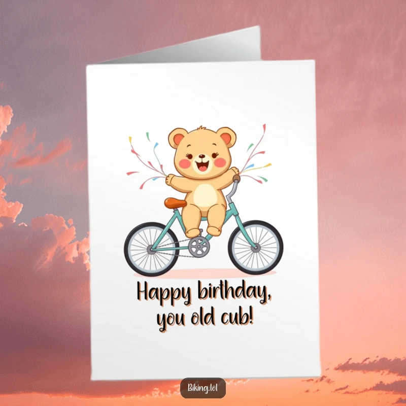 Funny Free Printable Birthday Card: Bear cub joyfully rides a bicycle with streamers flying, spreading birthday cheer.