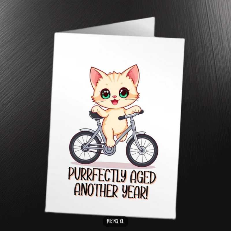 Funny Free Printable Birthday Card: A delighted kitten with wide eyes precariously balancing on a stationary bicycle crank.