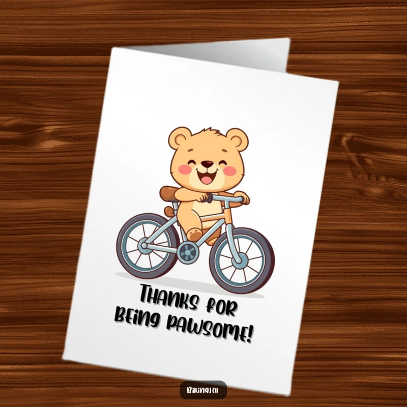 Funny Free Printable Thank You Card: Happy bear cub pedaling a bicycle with oversized wheels and a wide grin, offering thanks.