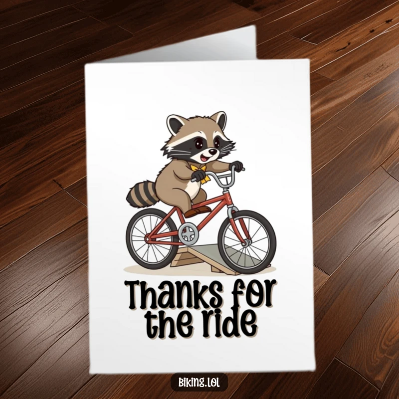 Funny Free Printable Thank You Card: A playful raccoon attempts a bicycle jump over a ramp on a vintage bike, showing thanks.
