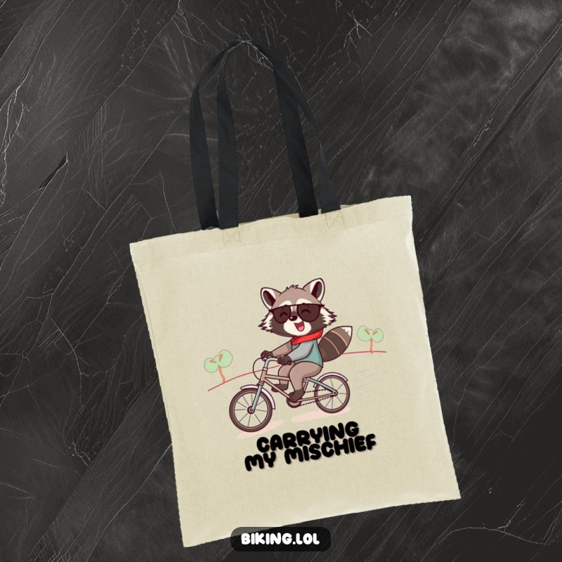 Funny raccoon tote bag, a jolly raccoon speeding downhill on a tiny tandem bike, humorous and practical.